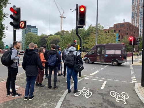 AAPS Students stood at traffic lights